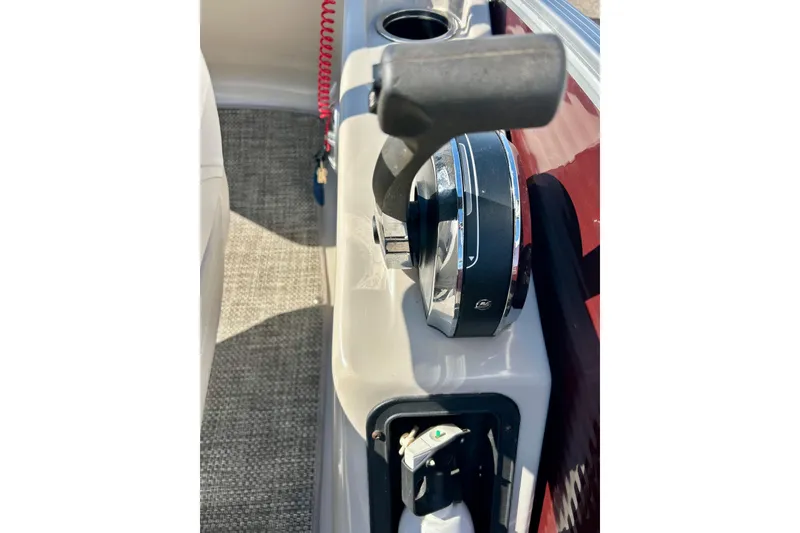 Slide: The Image of Close-up of 2016 Bennington R21 boat throttle control and cup holder. - 45