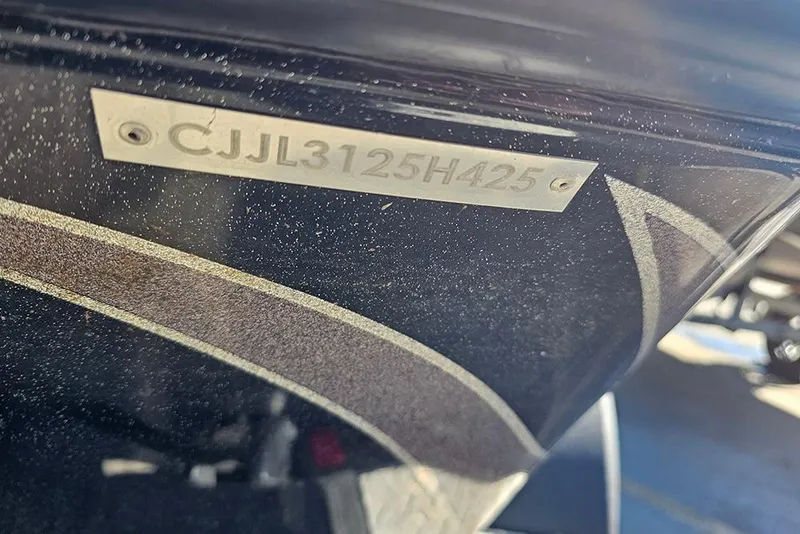 Slide: The Image of 2025 Phoenix 819 ZXL boat hull identification number plate close-up. - 13