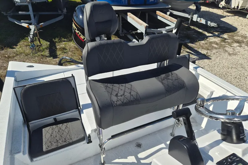 Slide: The Image of 2026 Xpress H20B Bay boat interior with seating and steering wheel. - 8