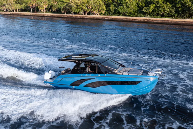 The Image of 2026 Hanover 347 boat cruising on a scenic waterway. - 1