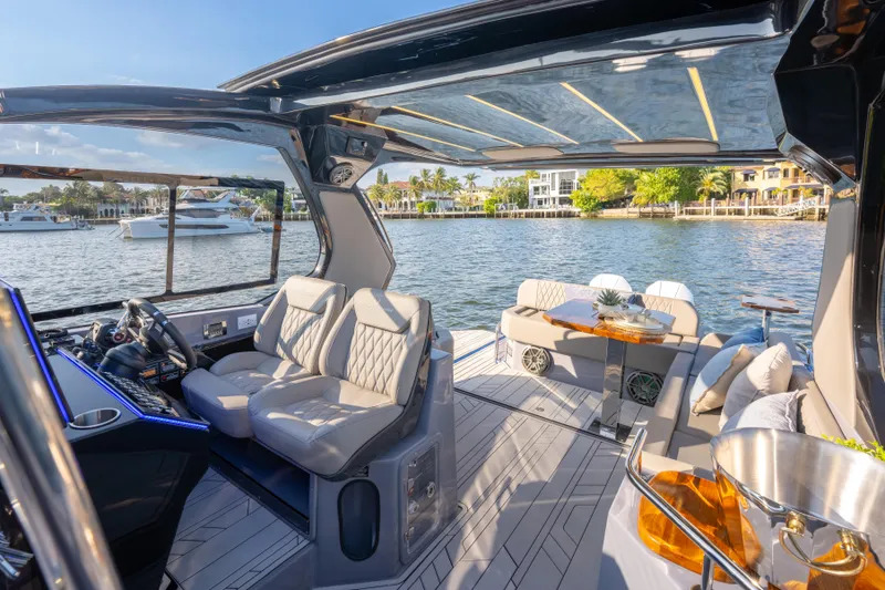 Slide: The Image of Luxurious 2026 Hanover 347 yacht interior with plush seating and elegant design on a sunny day. - 28