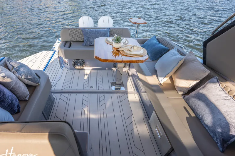 Slide: The Image of Luxurious 2026 Hanover 347 boat interior with elegant seating and stylish decor on the water. - 30