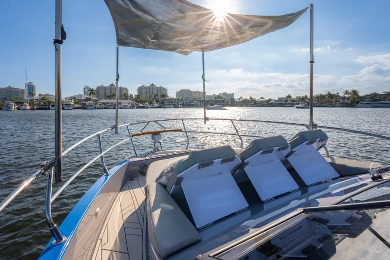 Slide: The Image of Luxurious Hanover 347 yacht, 2026 model, cruising on a sunny waterfront with city skyline. - 35