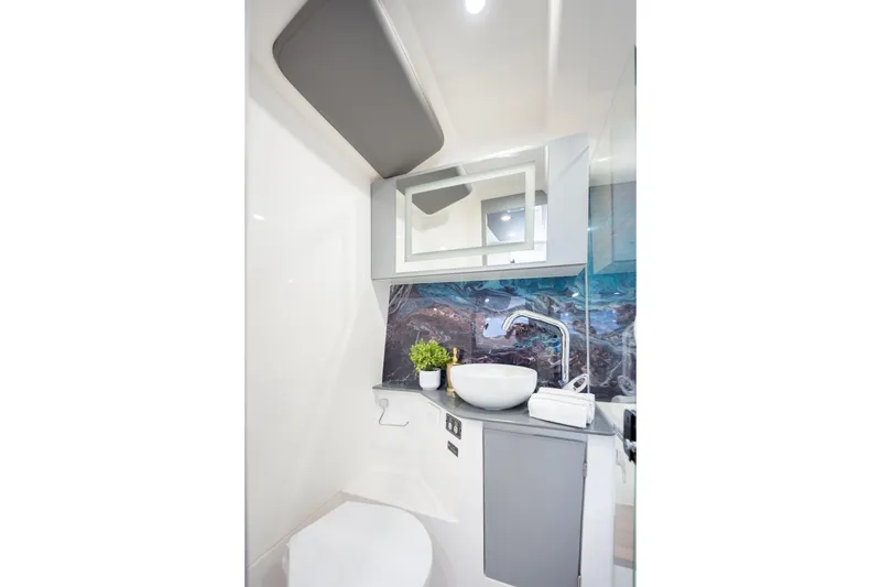 Slide: The Image of Modern bathroom in 2026 Hanover 347 RV with stylish sink and decorative backsplash. - 51