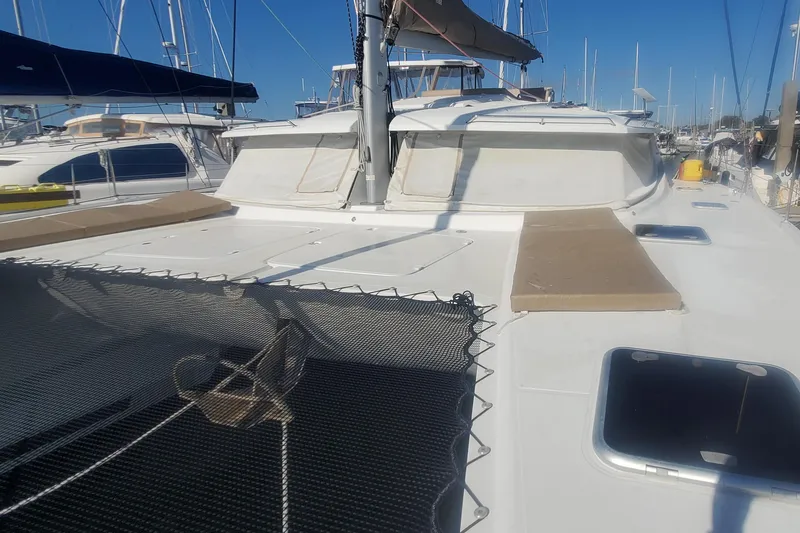 Slide: The Image of 2018 Fountaine Pajot Helia 44 Evolution catamaran docked at marina, sunny day. - 1