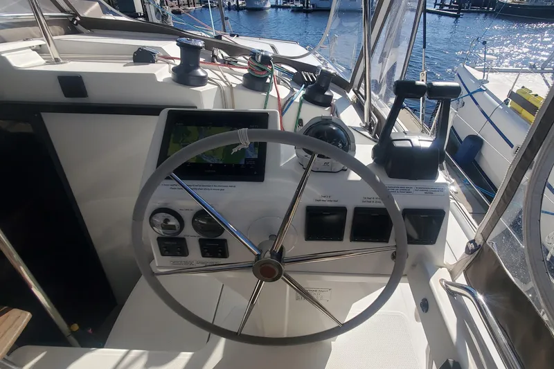 Slide: The Image of Helm of 2018 Fountaine Pajot Helia 44 Evolution catamaran with navigation instruments. - 2