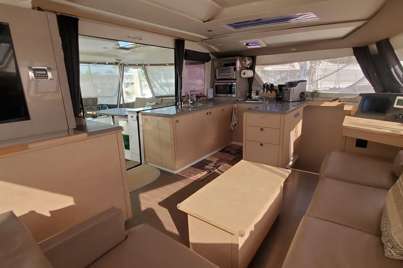 Slide: The Image of Luxurious interior of 2018 Fountaine Pajot Helia 44 Evolution catamaran, featuring modern kitchen and seating. - 5