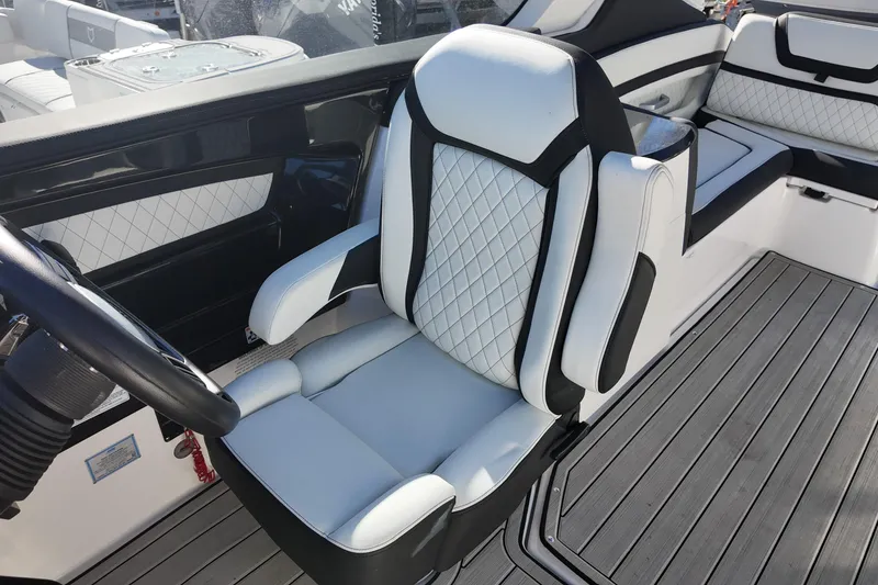 Slide: The Image of 2024 Yamaha Boats 275SE interior with luxurious seating and modern design. - 12