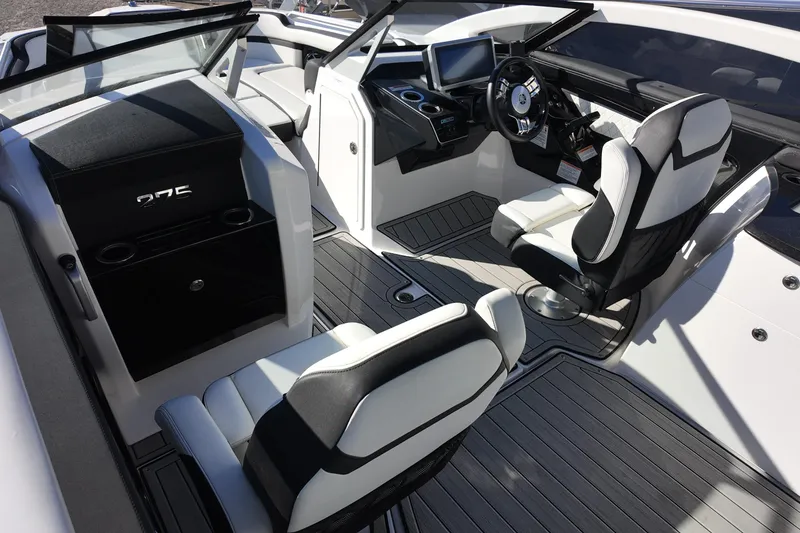 Slide: The Image of 2024 Yamaha Boats 275SE interior with modern helm and seating. - 13