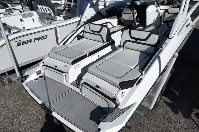 Slide: The Image of 2024 Yamaha Boats 275SE with sleek seating and modern design on display. - 4