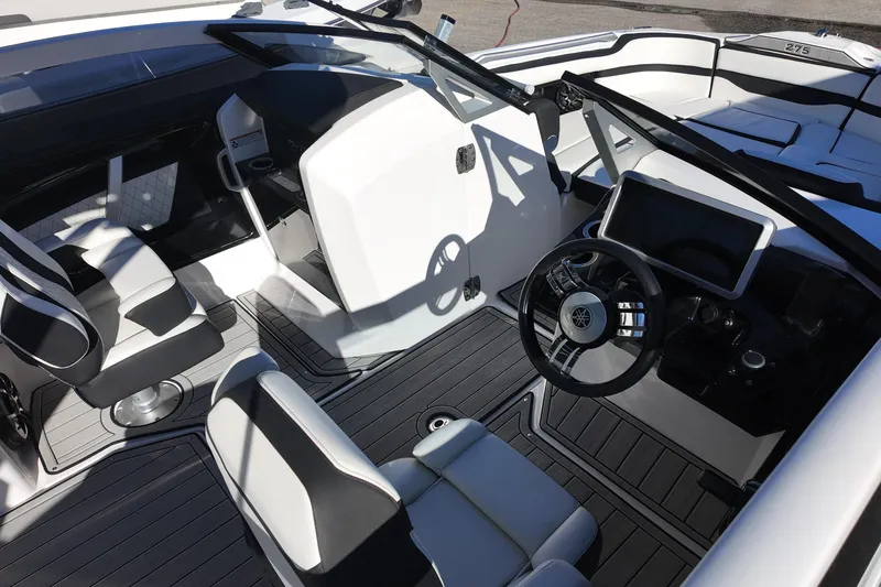 Slide: The Image of 2024 Yamaha Boats 275SE interior with modern dashboard and seating. - 6