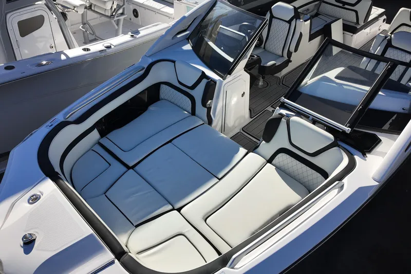 Slide: The Image of 2024 Yamaha Boats 275SE interior with luxurious seating and modern design. - 9