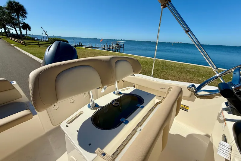 Slide: The Image of 2026 Scout 195 Sportfish boat interior with scenic waterfront view. - 13