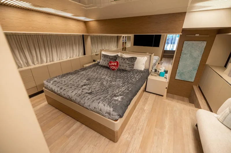 Slide: The Image of Luxurious bedroom interior of 2021 Ferretti Yachts 920 with elegant decor and plush bedding. - 14