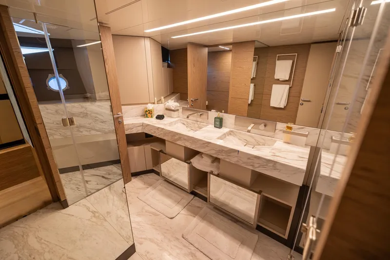 Slide: The Image of Luxurious bathroom in 2021 Ferretti Yachts 920, featuring marble countertops and modern design. - 17