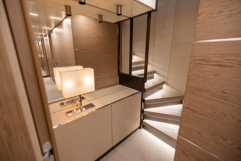 Slide: The Image of Luxurious interior of 2021 Ferretti Yachts 920 with modern staircase and elegant lighting. - 21