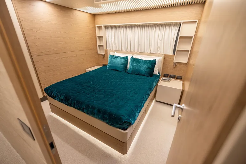 Slide: The Image of Luxurious bedroom interior on 2021 Ferretti Yachts 920, featuring elegant teal bedding. - 22