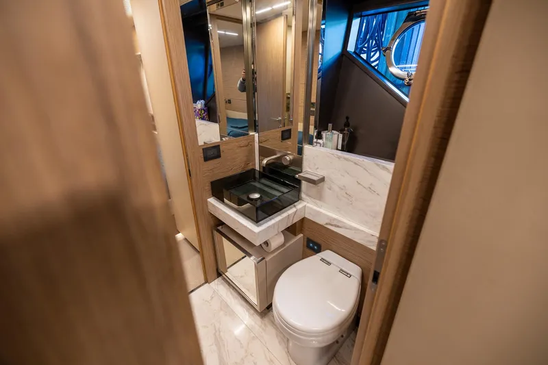 Slide: The Image of Luxurious bathroom in 2021 Ferretti Yachts 920, featuring elegant marble and modern fixtures. - 29