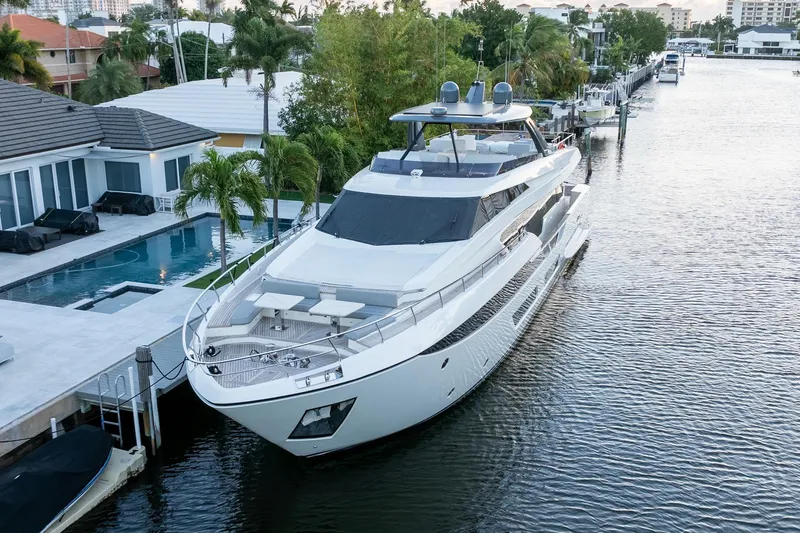 Slide: The Image of Luxurious 2021 Ferretti Yachts 920 docked by a modern waterfront home. - 3