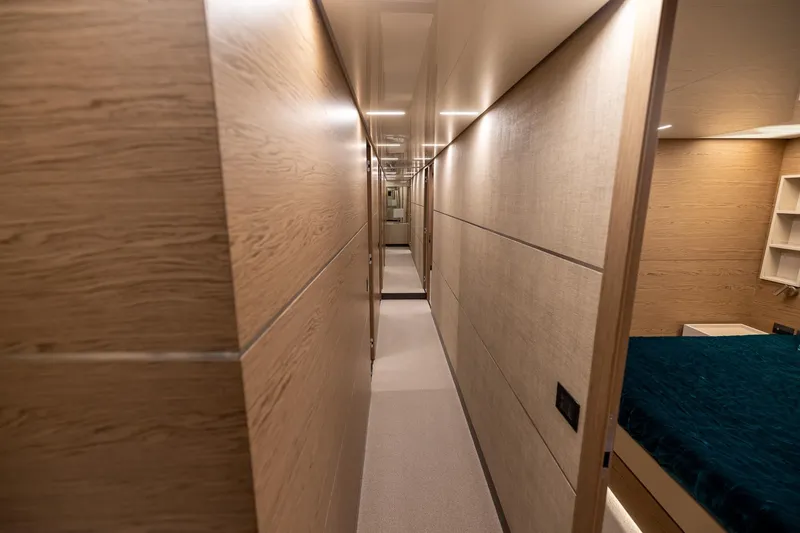 Slide: The Image of Luxurious hallway interior of 2021 Ferretti Yachts 920, featuring elegant wood paneling. - 30
