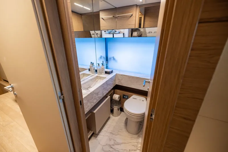 Slide: The Image of Luxurious bathroom interior on 2021 Ferretti Yachts 920, featuring marble accents and modern fixtures. - 31
