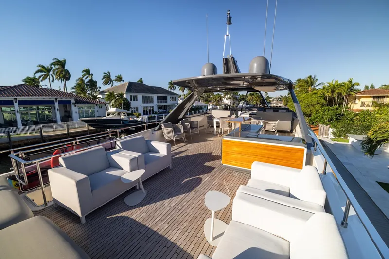 Slide: The Image of Luxurious 2021 Ferretti Yachts 920 deck with modern seating and scenic waterfront view. - 36