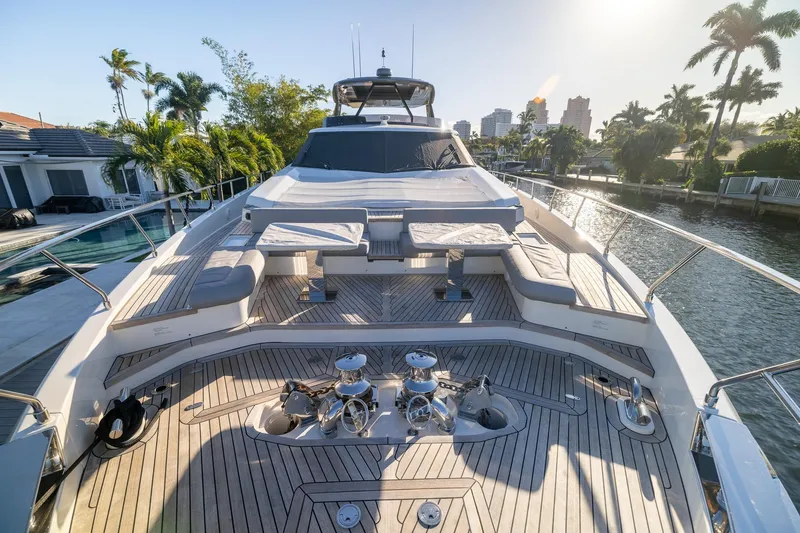 Slide: The Image of Luxurious 2021 Ferretti Yachts 920 on a sunny waterfront, showcasing elegant deck design. - 4