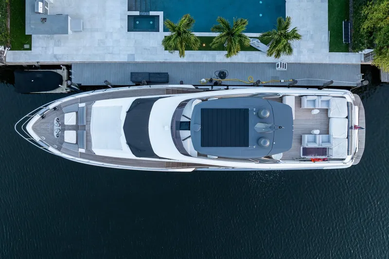 Slide: The Image of Aerial view of 2021 Ferretti Yachts 920 docked by a luxurious poolside. - 5