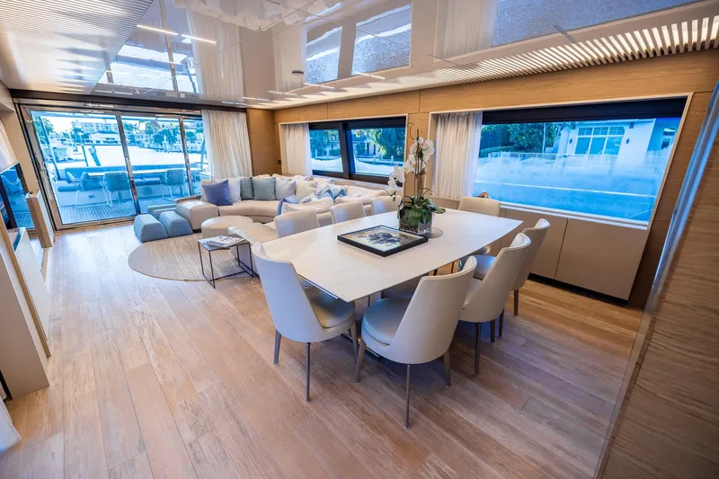 Slide: The Image of Luxurious interior of 2021 Ferretti Yachts 920 with elegant dining and seating area. - 9