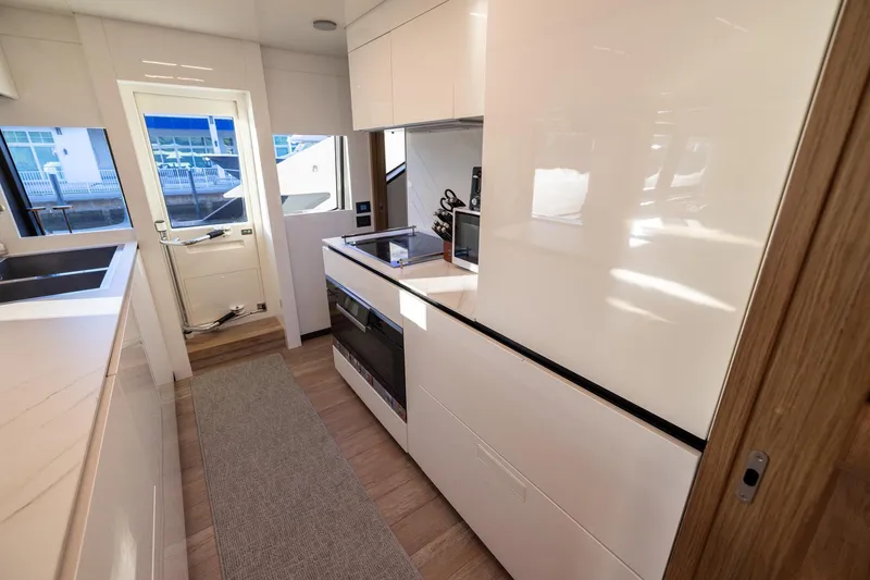 Slide: The Image of Modern kitchen interior of 2021 Ferretti Yachts 920 with sleek design and appliances. - 12
