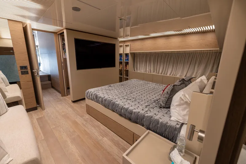 Slide: The Image of Luxurious bedroom interior of 2021 Ferretti Yachts 920 with modern design and cozy bedding. - 16