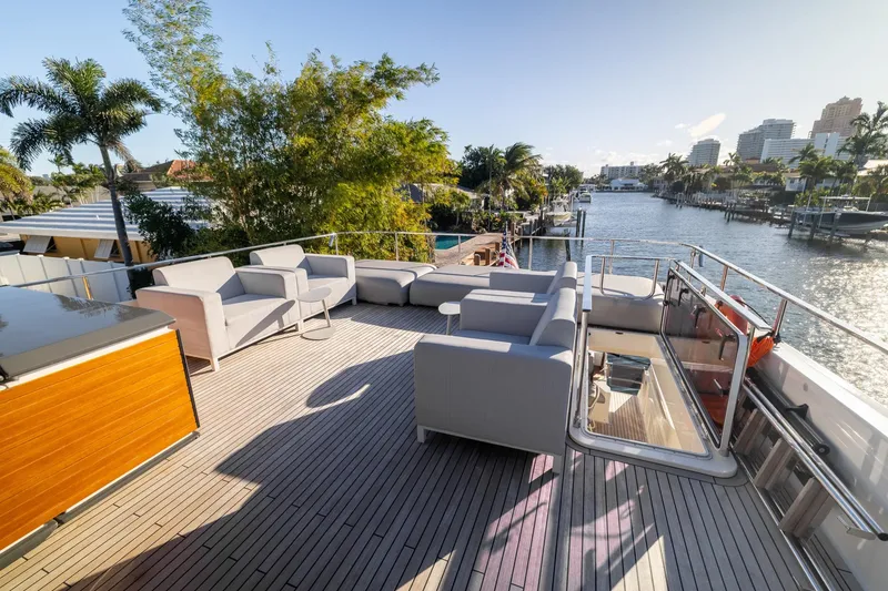 Slide: The Image of Luxurious deck of 2021 Ferretti Yachts 920 with modern seating and scenic waterfront view. - 35