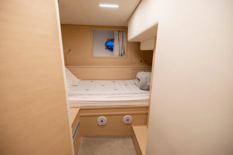 Slide: The Image of Luxurious cabin interior of 2021 Ferretti Yachts 920 with cozy bed and porthole view. - 40