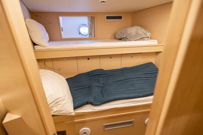 Slide: The Image of Cozy cabin with bunk beds in 2021 Ferretti Yachts 920, featuring light wood interior. - 41