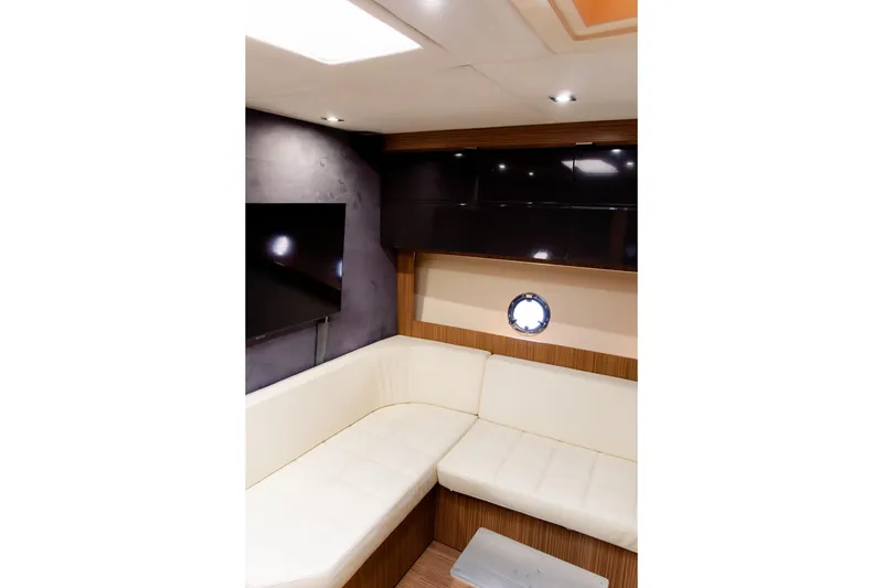 Slide: The Image of Luxurious interior of 2013 Azimut Atlantis 48 yacht with modern seating and porthole. - 10