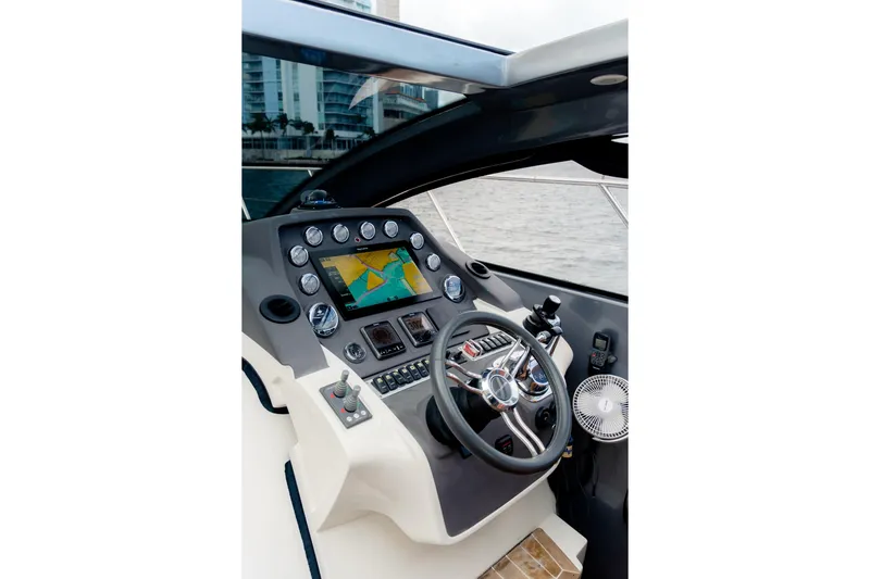 Slide: The Image of Helm of 2013 Azimut Atlantis 48 yacht with navigation controls and display. - 13