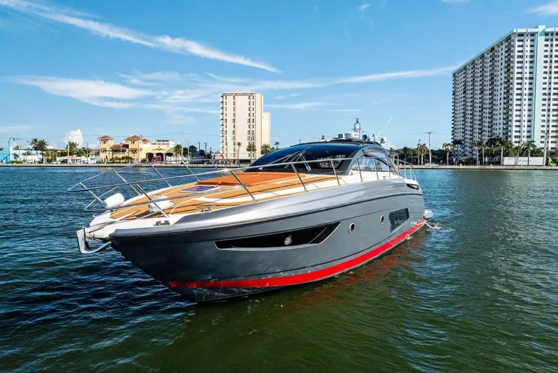 Slide: The Image of Azimut Atlantis 48 yacht, 2013 model, cruising in a sunny urban waterfront setting. - 2