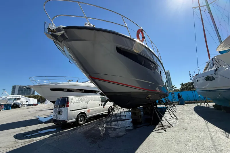 Slide: The Image of 2013 Azimut Atlantis 48 yacht on dry dock under clear blue sky. - 28