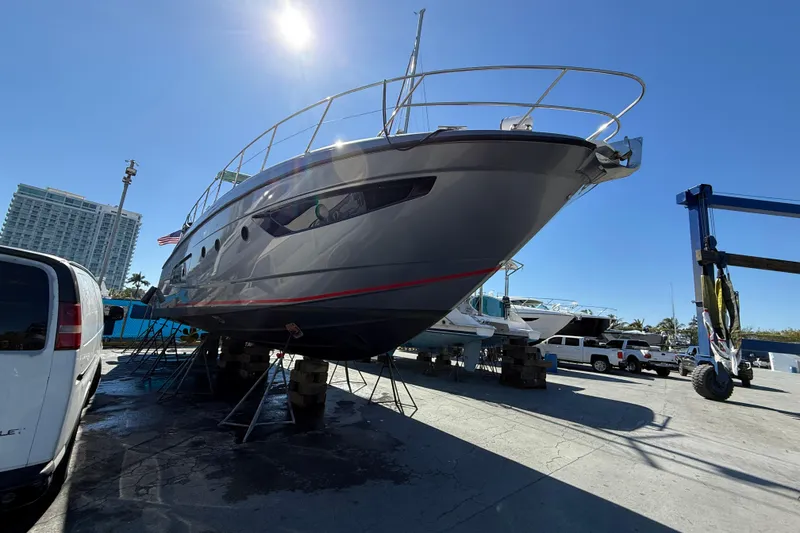 Slide: The Image of 2013 Azimut Atlantis 48 yacht on dry dock under clear blue sky. - 29