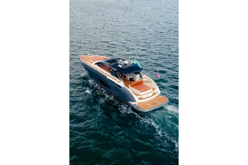 Slide: The Image of 2013 Azimut Atlantis 48 yacht cruising on open water, showcasing sleek design and luxury features. - 6