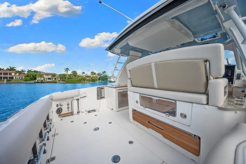 Slide: The Image of Boston Whaler 380 Realm 2026: Spacious cockpit with luxurious seating and a view of the water. - 43