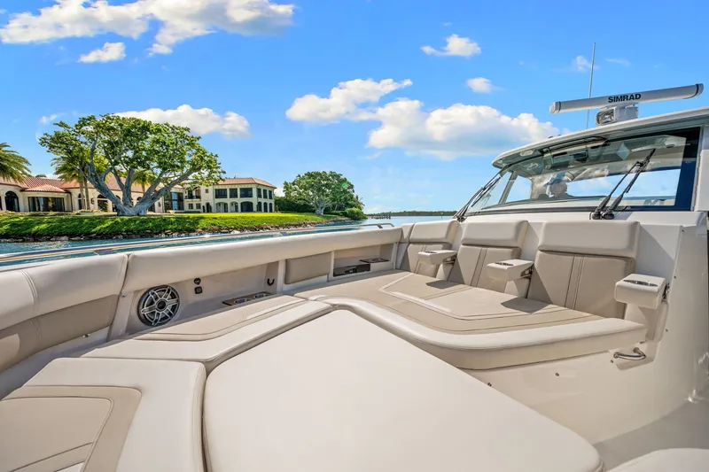 Slide: The Image of The image shows the spacious cockpit of a Boston Whaler 380 Realm with comfortable seating. - 20