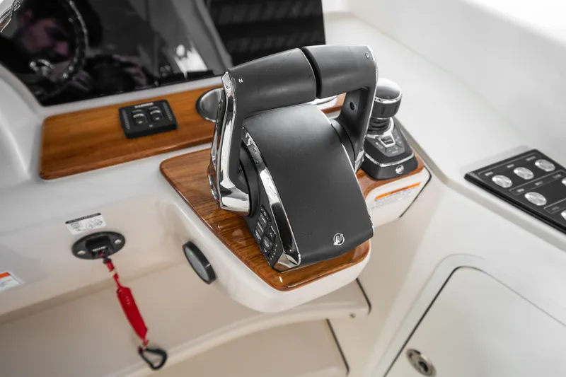Slide: The Image of Close-up of a Boston Whaler 380 Realm helm with modern controls. - 37