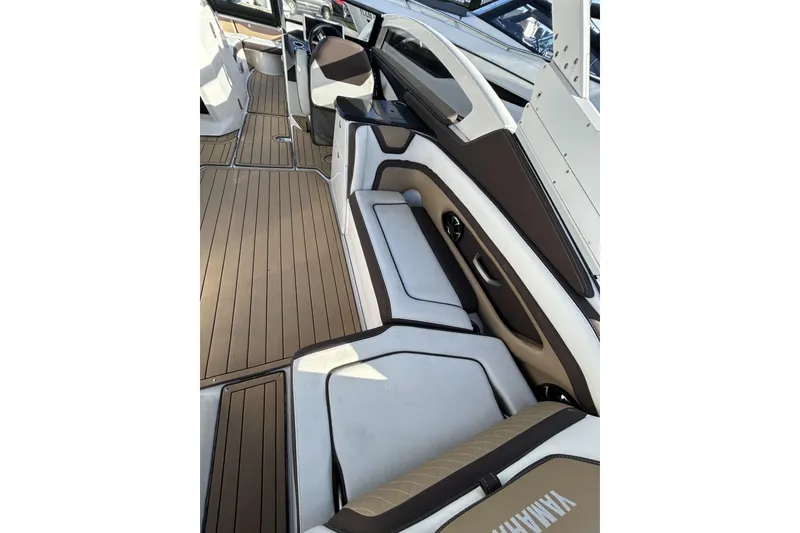 Slide: The Image of 2021 Yamaha Boats 275SE interior with sleek seating and modern design. - 12
