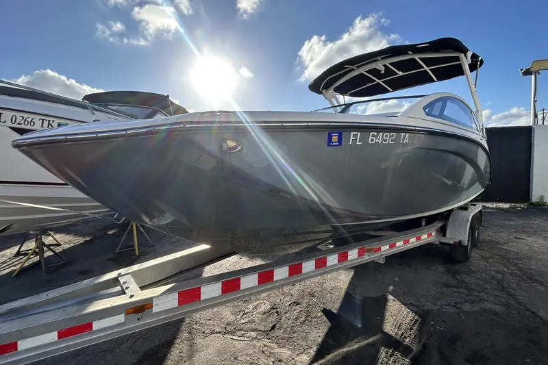 Slide: The Image of 2021 Yamaha Boats 275SE on trailer, sunlit, with Florida registration. - 2