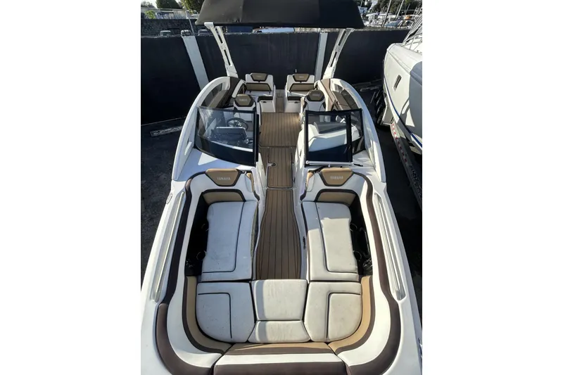 Slide: The Image of 2021 Yamaha Boats 275SE interior with spacious seating and sleek design. - 8