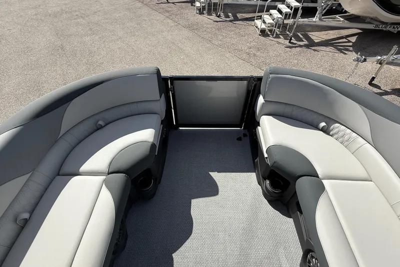 Slide: The Image of 2026 Avalon 2385 LSZ Tri Toon boat interior with plush seating and modern design. - 19