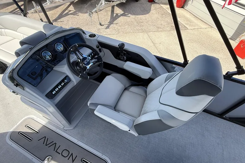 Slide: The Image of 2026 Avalon 2385 LSZ Rear Fish boat interior with steering console and seating. - 26
