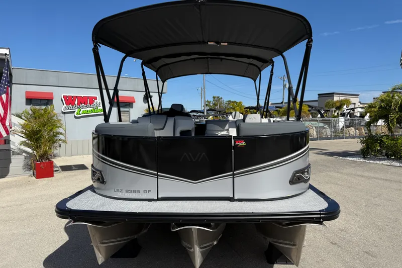 Slide: The Image of 2026 Avalon 2385 LSZ Rear Fish Tri Toon boat at dealership, showcasing high performance design. - 4