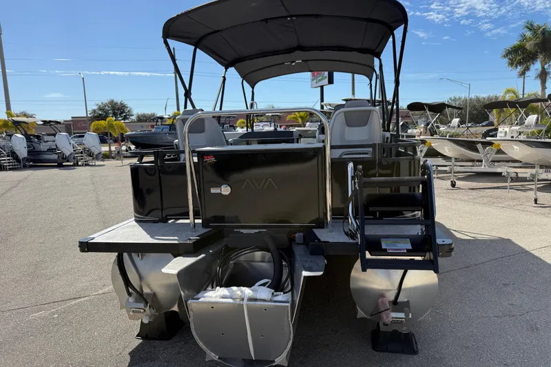 Slide: The Image of 2026 Avalon 2385 LSZ Rear Fish Tri Toon boat, high performance, parked outdoors. - 7